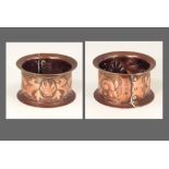 NEWLYN COPPER. A Newlyn napkin ring decorated with seashells. Stamped 'NEWLYN'. Diameter 5.5cm.