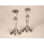 CANDLESTICKS. A pair of modern candlesticks. Birmingham 1972. Height 14.5cm.