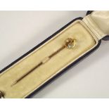 STICK PIN. A 15ct. gold, pearl & aquamarine stick pin, cased.