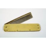 MOUSTACHE COMB. A folding moustache comb in ivory case.