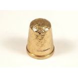 GOLD THIMBLE. A 9ct. gold thimble. Approx. 5g.