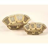 MINIATURE BASKETS. Two 19th century miniature, fret-pierced bone baskets. Smallest, 6.5 x 5.5cm.