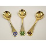 GEORG JENSEN. Three Georg Jensen silver gilt & enamel year spoons for 1972, 1979 & 1984.