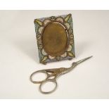 SCISSORS & FRAME. A pair of gilt metal needlework scissors & a small micromosaic frame.