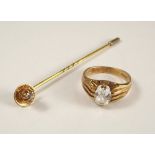 STICK PIN. A 15ct. gold diamond solitaire stick pin & a gentleman's 9ct. gold stone set ring.