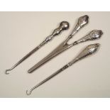 BUTTON HOOKS ETC. Silver mounted button hooks & glove stretchers (3).