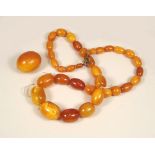 AMBER. A string of amber beads. Largest bead length 2.2cm. Approx. 39g.