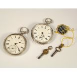 POCKET WATCHES. Two silver, open faced pocket watches with keys.