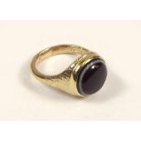 GOLD RING. A gentleman's 9ct. gold signet ring, set a banded agate. Approx. 10g.