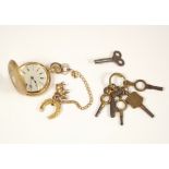 FOB WATCH. A 14ct. gold full hunter fob watch, each side enamelled & hung with two fob charms.