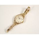 LADY'S WATCH. A lady's gold plated Tissot wristwatch on 9ct. gold expanding strap.