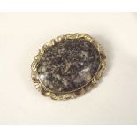 GRANITE BROOCH.