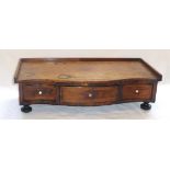 19th century table-top serpentine fronted dressing stand with three drawers and gallery rim, on