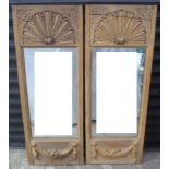 Pair of carved oak wood mirrors, relief scallop and swag decoration, 101x38cm