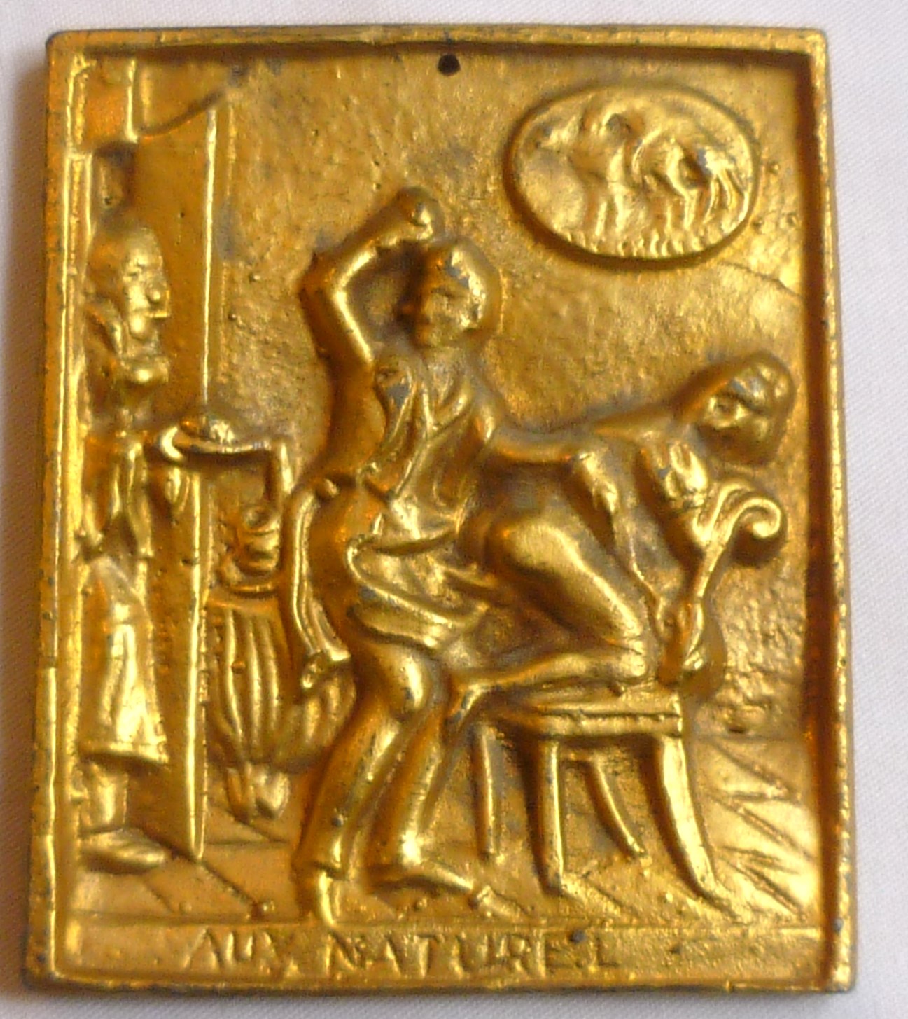 Victorian gilt metal erotic plaque titled Aux Naturel