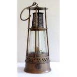Brass and glass miner's lamp of conical form stamped 6112