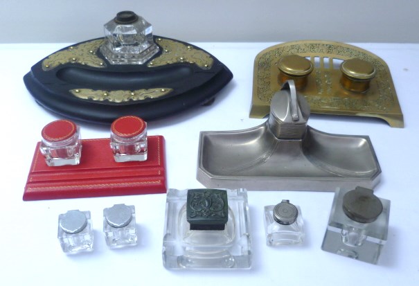 Collection of standish inkstands and glass inkwells including brass, leatherette, white metal and