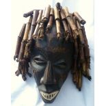 African Chokwe Mwano Pwo Angolan Tribal wood mask with braided hair in wooden tubes, scarified,
