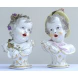 Pair of Continental 19th century painted porcelain busts of a boy and a girl with open mouths and