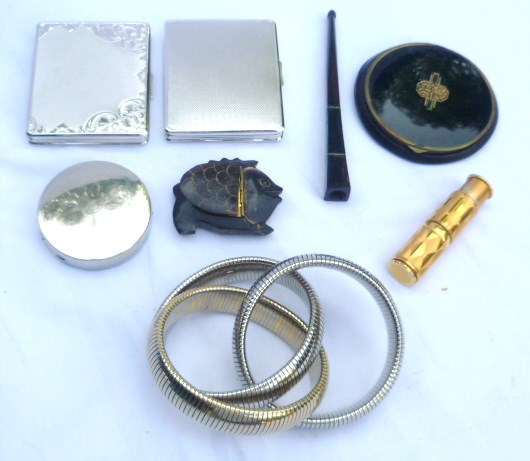 Collection of compacts, lipstick holder, cigarette holder and expandable bangle bracelet