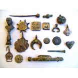 Collection of metal detecting finds comprising brooches, pendants, coins, buttons and weights