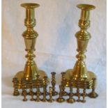 Pair of 19th century brass candlesticks with ejectors, stepped bases, 26cm high, together with a