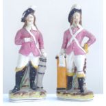 Pair of 19th century Staffordshire models of military officers in pink tunics on oval bases
