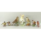 A group of ceramic figurines comprising a Royal Worcester figurine of 'April' 3416, modelled by F.
