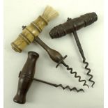 A Georgian corkscrew with a turned hardwood handle lacking hair, 14cm,