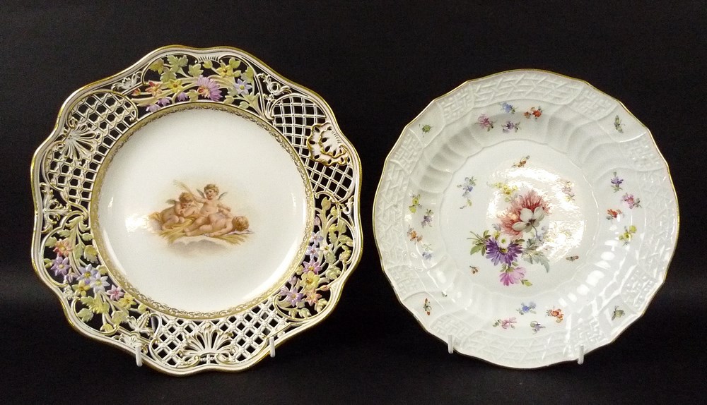 A Meissen, New Osier, plate, hand painted with floral sprays and butterflies, marked to base, 23cm,