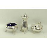 A silver three piece cruet set, comprising mustard pot with blue glass liner, and pepper shaker,