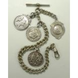 A collection of silver medals comprising two 'Mitchell Hamer Challenge Cup Winners' medals,