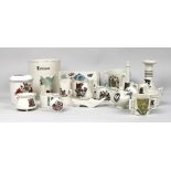 A collection of W. H. Goss crested ware comprising vases, bowls, candlesticks, and novelty models.