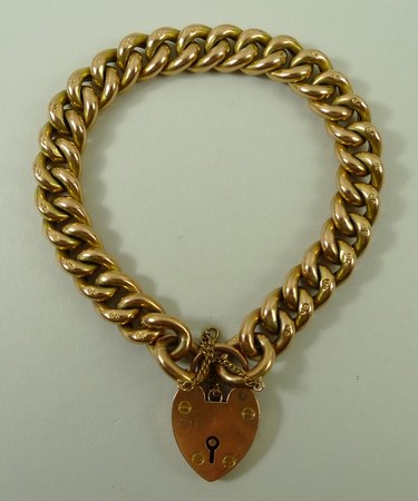 A 9ct gold link bracelet with pad lock clasp and safety chain, 20.2g. - Image 4 of 4