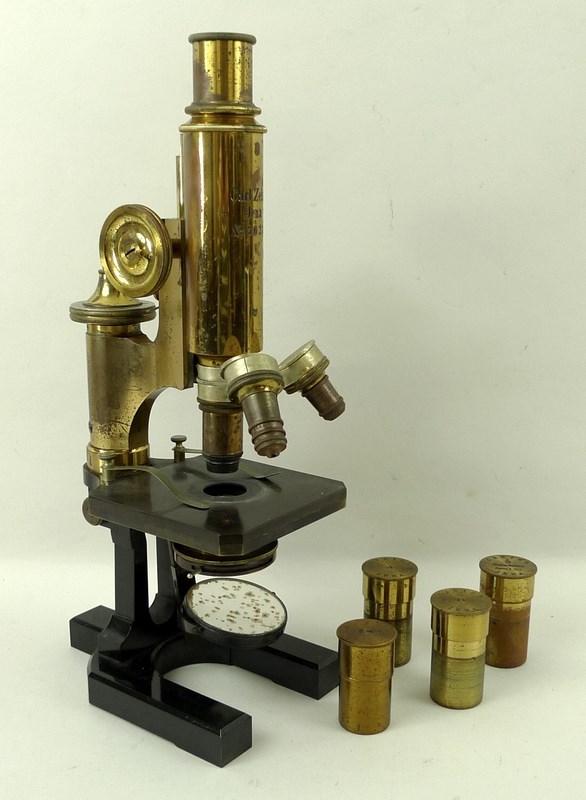 A Carl Zeiss Jena microscope, number 36230, with four lenses and cases, in fitted mahogany case,