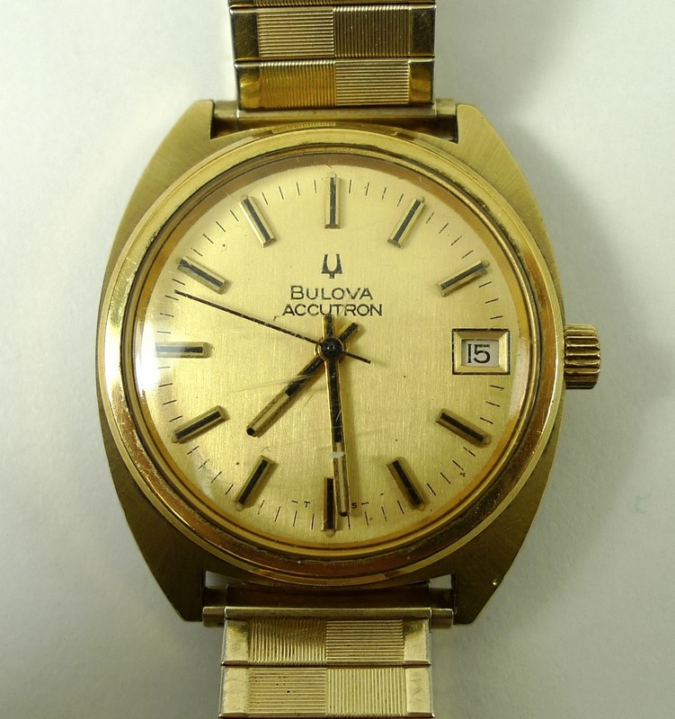 A gentleman's Bulova Accutron watch, the circular dial with baton numerals and date aperture,