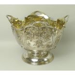 A Victorian silver rose bowl, the embossed bowl with cast scrolled rim, gilt interior,