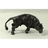 A bronze figure of a raging bull, 20th century, monogrammed J.M, 5 by 9cm.
