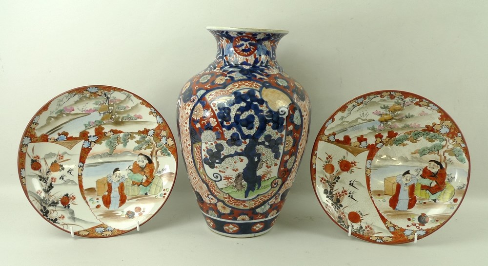 A ceramic baluster vase, 19th century, in Imari colours, 32cm, and a pair of Kutani plates,