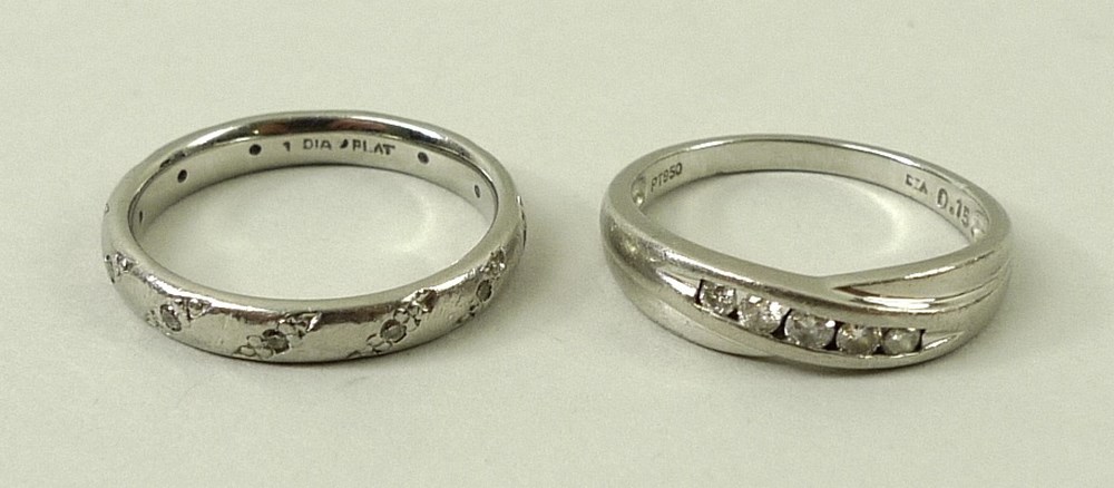 A platinum and diamond ring, retailed by H.