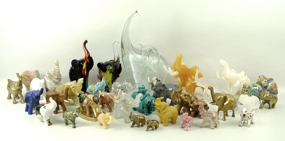 A collection of elephant ornaments, 20th century, including Murano and Mdina glass, Georg Jenson,
