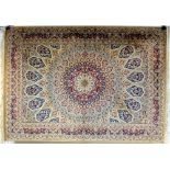 A Keshan rug with fawn ground,