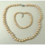 A string of pink cultured pearls, circa 2000, reportedly freshwater pearls, 41cm,