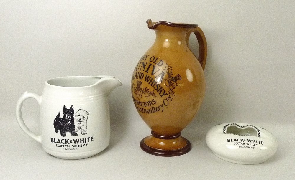 A Doulton Lambeth salt glaze jug, tan ground, 'Very Old Duniva Highland Whisky,