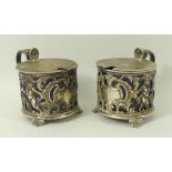 A pair of silver salts, cast with cherubs, having blue liners, Sheffield 1899,