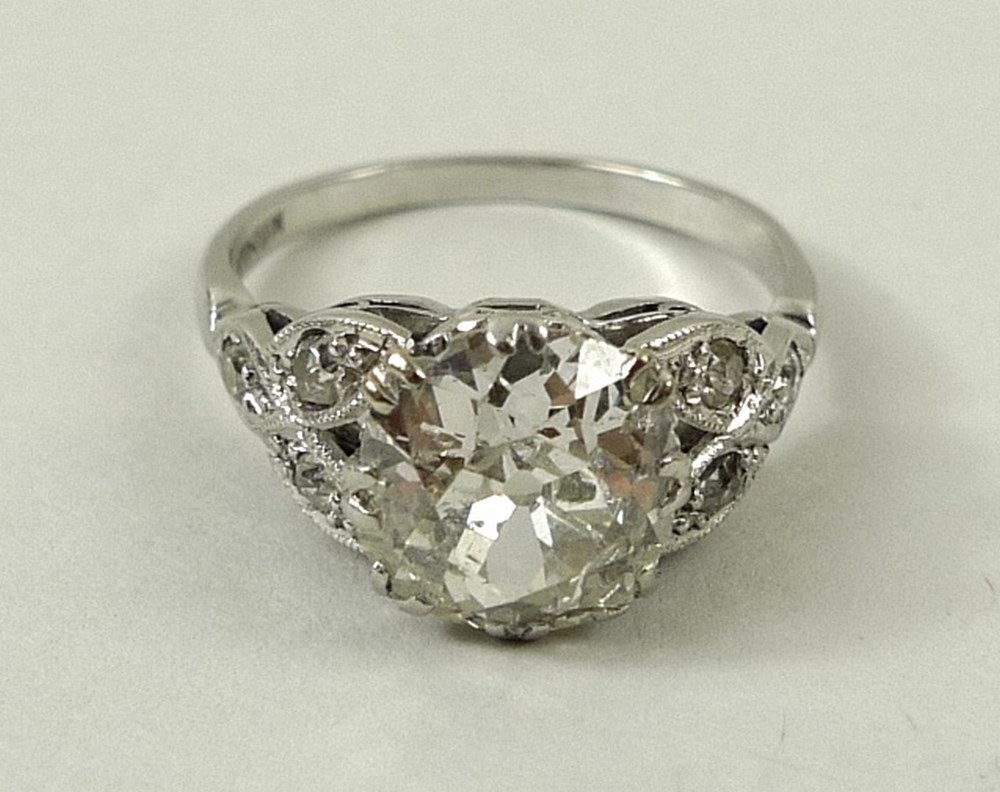 A platinum and diamond solitaire ring, the central old cut diamond approximately 1.