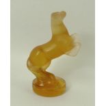 A Lalique amber glass figurine of a horse, 20th century, 'Cachet Cheval Or' (seal horse gold,