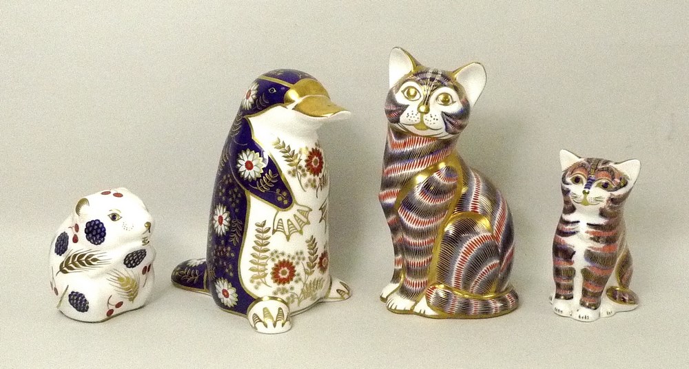 A collection of four Royal Crown Derby paperweights, comprising a cat, 1988, 14cm high,