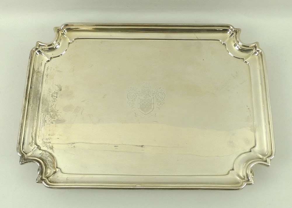 An Edwardian silver tray, rectangular with incuse corners, engraved crest of 'Wandsworth' family,