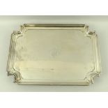 An Edwardian silver tray, rectangular with incuse corners, engraved crest of 'Wandsworth' family,